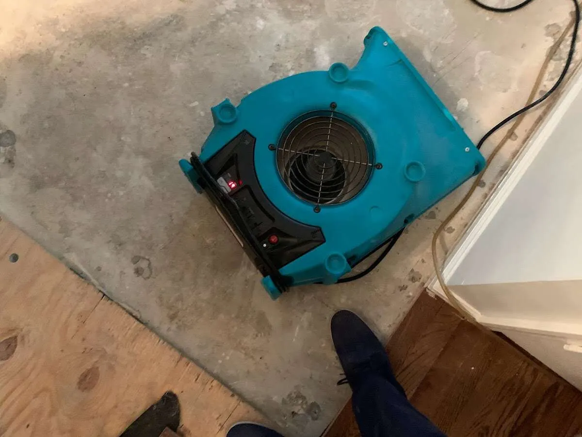 Air mover drying subfloor during Leak Detection & Repair in Lake St. Louis
